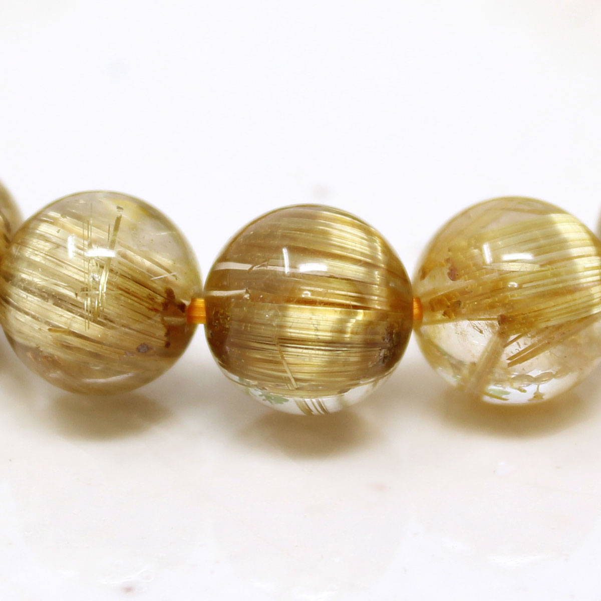 極上 10-10.5ミリ タイタン ルチルクォーツ （金線入水晶