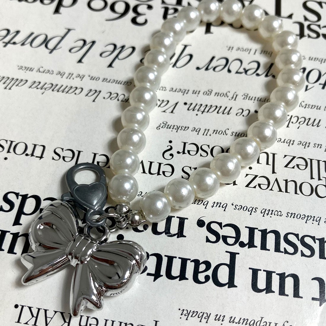 ノンヘッジ non-hedge ☆WEB限定☆パールリボンチャーム （ホワイト