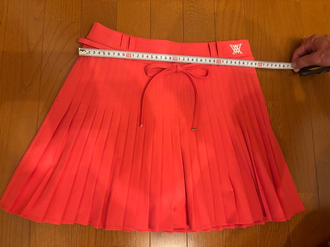 アニユーゴルフ コーラルピンク プリーツスカート