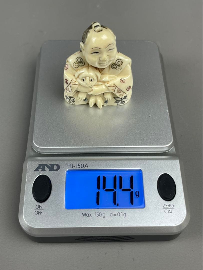 カバ牙製 根付 犬を抱く唐子 提物 骨董品 古美術 置物 天然