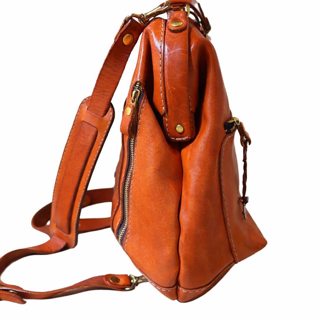 ヘルツ わんぱくリュック がま口 レザー バックパック ロック金具 鍵