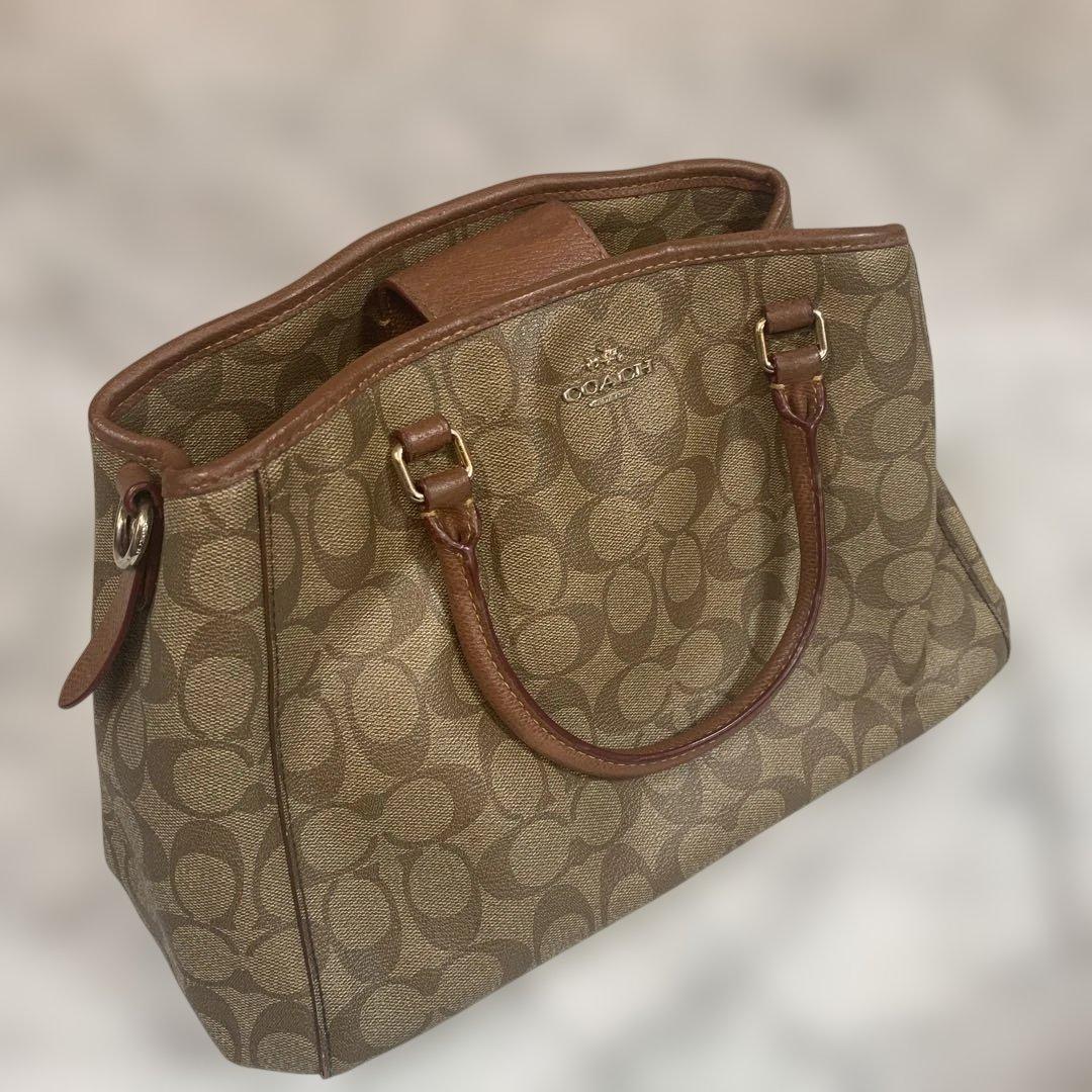 Coach ブラウン トートバッグ ハンドバッグ ブラウンのロゴパターンが