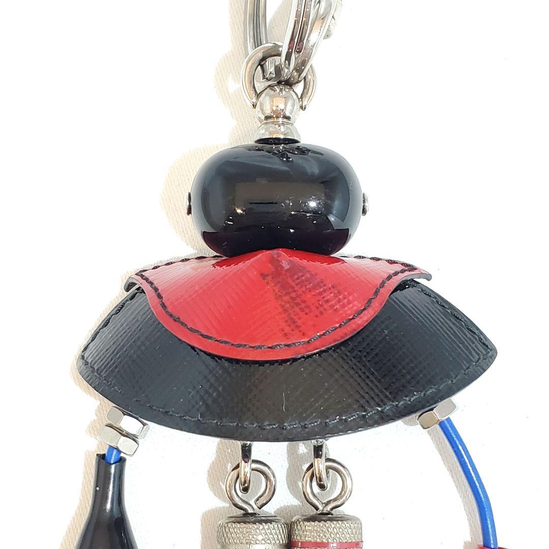 プラダ キーリング サフィアーノ ドラキュラ ロボット トリック 三角