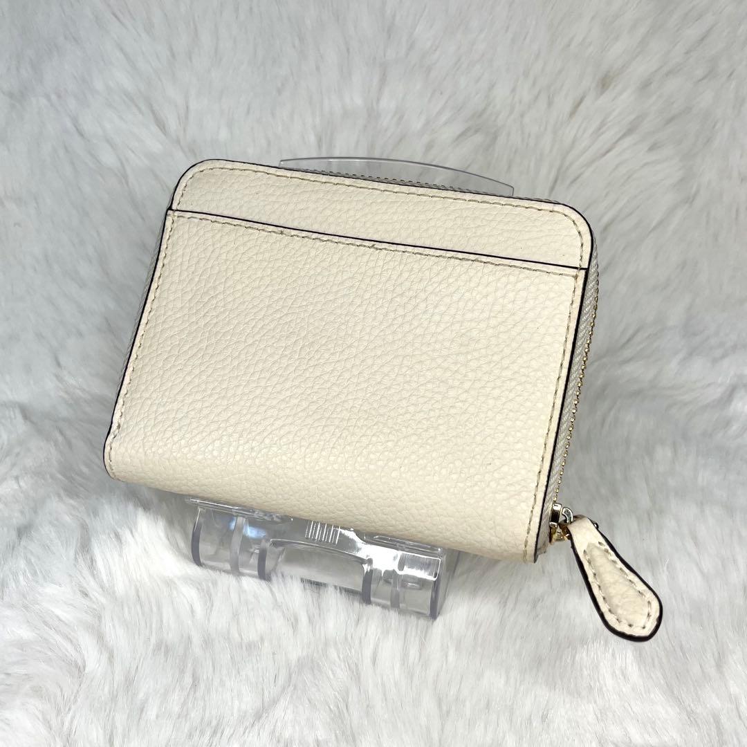 美品】COACH アイボリー 二つ折り財布 - メルカリ