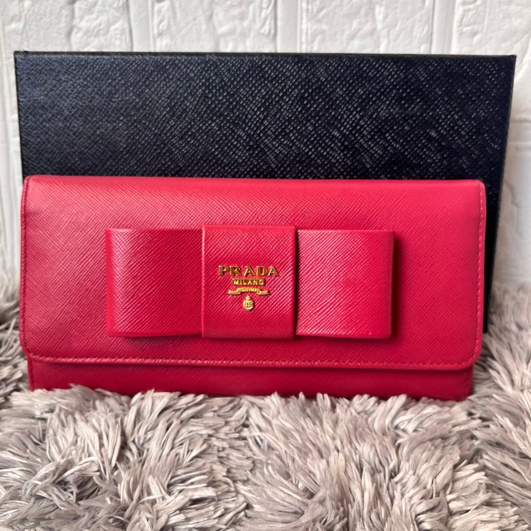 良品✨PRADA フィオッコ　サフィアーノ　メタルロゴ　リボン　ピンク　長財布 PRADA（プラダ） リボン付きL字ファスナー長財布[小銭入れ付き] ローズ