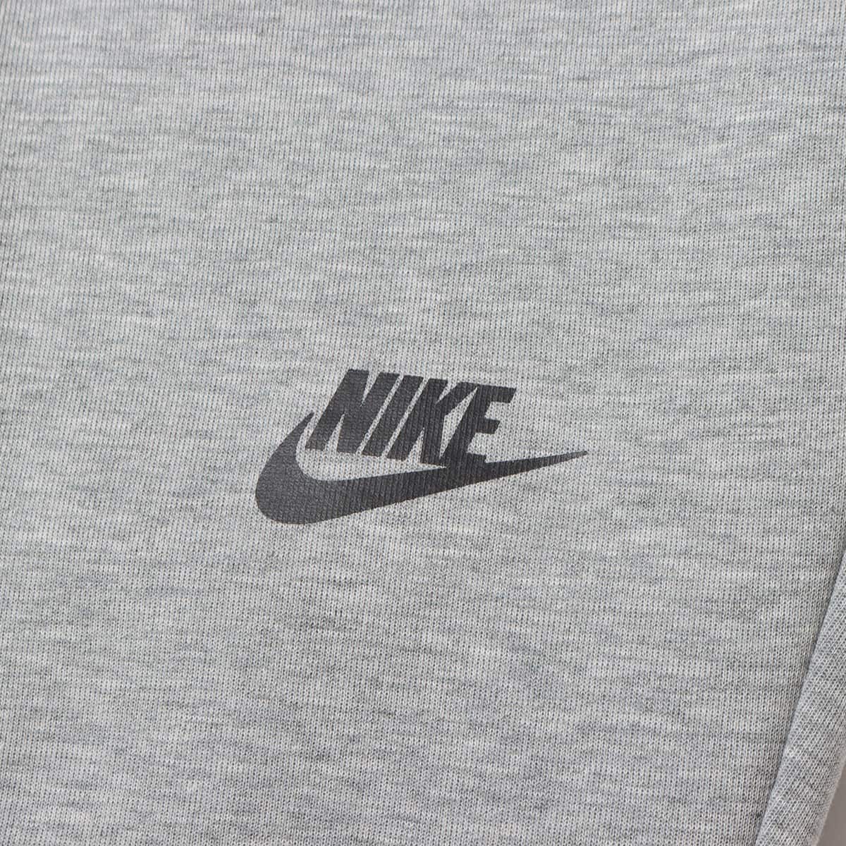 NIKE AS M NK TCH FLC JGGR OG 10YR DK GREY HEATHER/BLACK 23FA-I